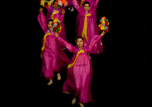 North Korean women dancing in choson-ot during the Arirang mass games in may day stadium, Pyongan Province, Pyongyang, North Korea