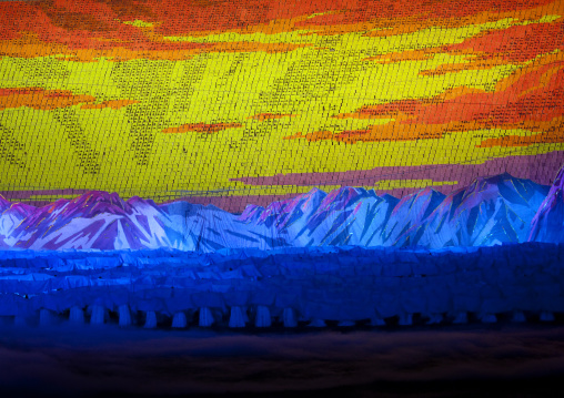 Rising sun over mount Paektu made by children pixels holding up colored boards during Arirang mass games in may day stadium, Pyongan Province, Pyongyang, North Korea