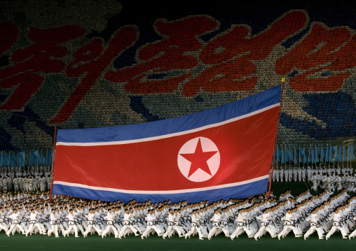 North Korean taekwondo team in front of a giant flag during the Arirang mass games in may day stadium, Pyongan Province, Pyongyang, North Korea