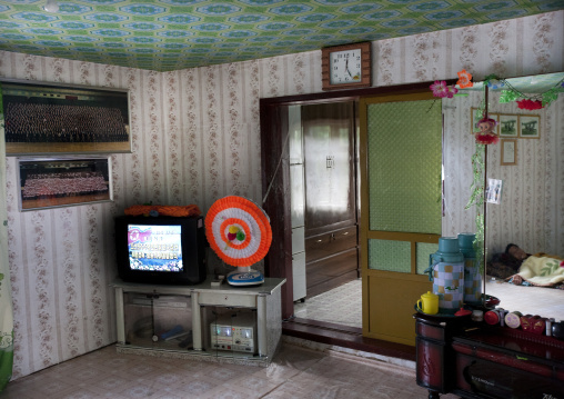 Forbidden picture of a ill North Korean man laying on a bed with a drip on his arm, North Hwanghae Province, Sariwon, North Korea