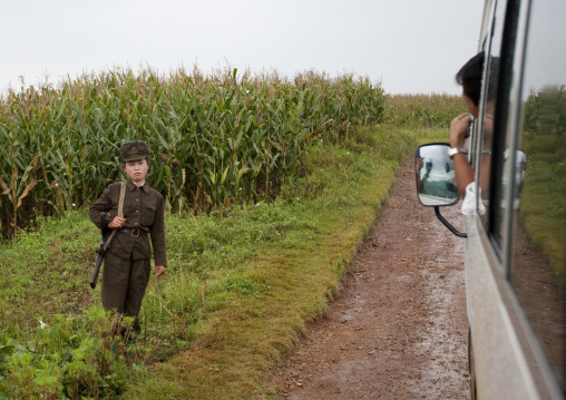 A bus driver speaks to a North Korean soldier in the countryside, North Hwanghae Province, Kaesong, North Korea