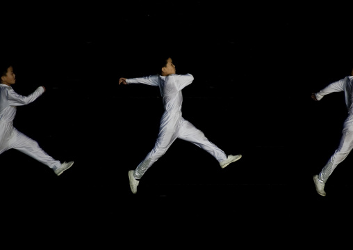 North Korean gymnasts jumping during the Arirang mass games in may day stadium, Pyongan Province, Pyongyang, North Korea