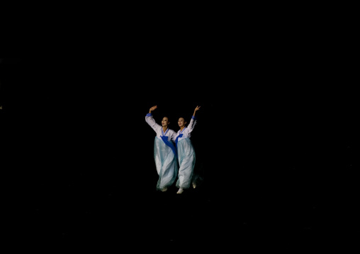 North Korean women dancing in choson-ot during the Arirang mass games in may day stadium, Pyongan Province, Pyongyang, North Korea