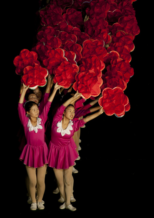 North Korean gymnasts with flowers at Arirang mass games in may day stadium, Pyongan Province, Pyongyang, North Korea