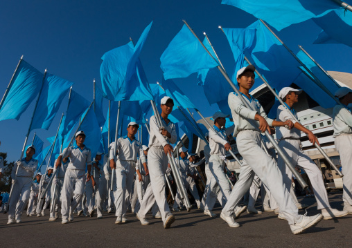 North Korean gymnasts with blue flags during the Arirang mass games in may day stadium, Pyongan Province, Pyongyang, North Korea