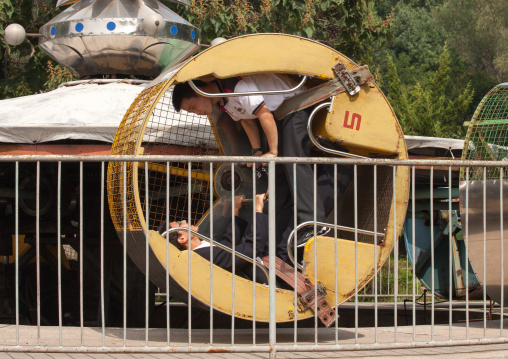 North Korean boys in an old attraction in Taesongsan funfair, Pyongan Province, Pyongyang, North Korea