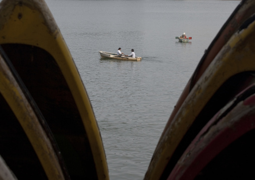 North Korean people in rowing boats on Taedong river, Pyongan Province, Pyongyang, North Korea