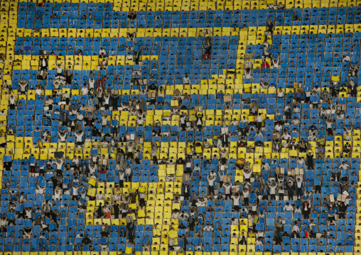 Children used to make human pixels by holding up colored boards during Arirang mass games in may day stadium, Pyongan Province, Pyongyang, North Korea