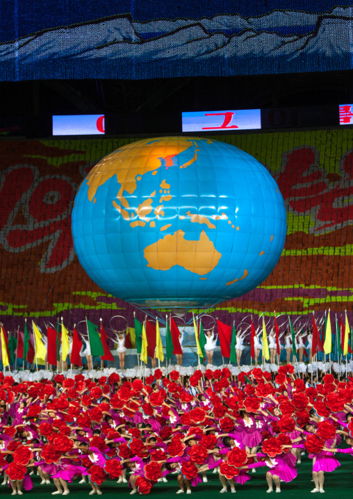 North Korean dancers in front of a world globe during the Arirang mass games in may day stadium, Pyongan Province, Pyongyang, North Korea