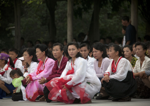 North Korean people squatting and waiting to visit the Kim il Sung Mangyongdae native house, Pyongan Province, Pyongyang, North Korea