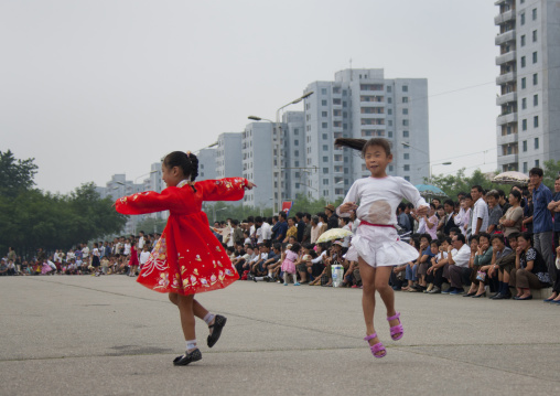 North Korean young girls dancing in traditional choson-ot on national day, Pyongan Province, Pyongyang, North Korea