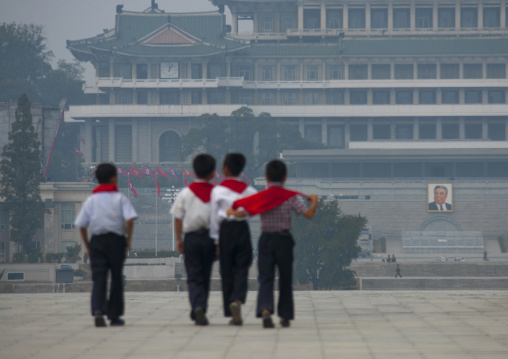 Rear view of North Korean pioneers boys in the street, Pyongan Province, Pyongyang, North Korea