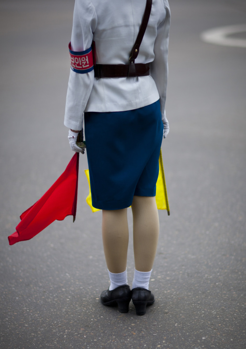 North Korean female traffic security officer in white uniform in the street, Pyongan Province, Pyongyang, North Korea