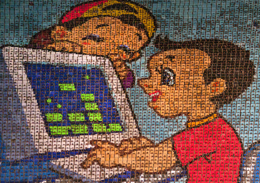 North Korean kids using a computer made by children holding up colored boards during Arirang mass games in may day stadium, Pyongan Province, Pyongyang, North Korea