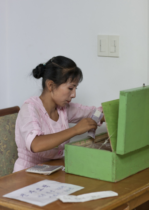 North Korean cashier woman at Kaeson youth park, Pyongan Province, Pyongyang, North Korea