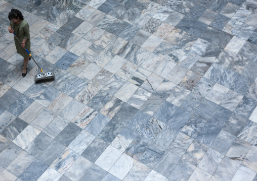 North Korean woman cleaning the floor in the Grand people's study house, Pyongan Province, Pyongyang, North Korea