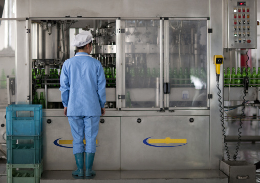 North Korean female worker in kangso yaksu mineral water factory, South Pyongan Province, Nampo, North Korea