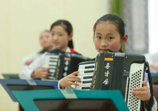 Accordion classroom with North Korean students in Mangyongdae children's palace, Pyongan Province, Pyongyang, North Korea