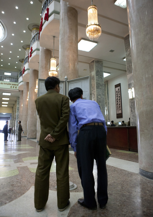 North Korean people reading the offical state newspaper in the Grand people's study house, Pyongan Province, Pyongyang, North Korea