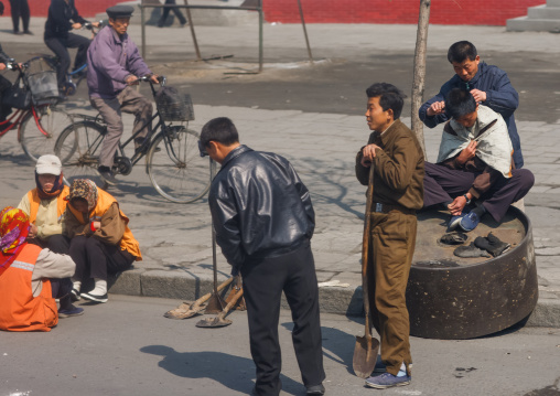 Hairdresser in the street, South Pyongan Province, Nampo, North Korea