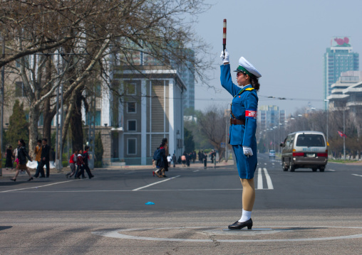 North Korean traffic security officer in blue uniform in the street, Pyongan Province, Pyongyang, North Korea