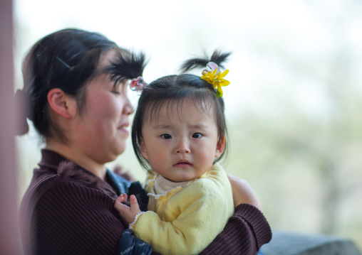 North Korean girl with her mother, Pyongan Province, Pyongyang, North Korea