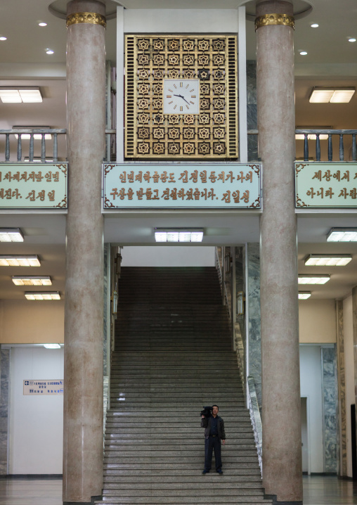 North Korean cameraman in the Grand people's study house hall, Pyongan Province, Pyongyang, North Korea