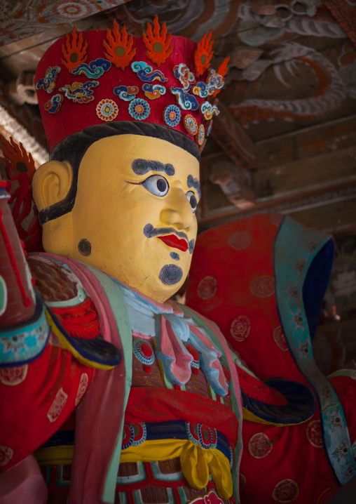 Colorful statue of damun-cheonwang heavenly king of the North at the Pohyon-sa Korean buddhist temple, Hyangsan county, Mount Myohyang, North Korea