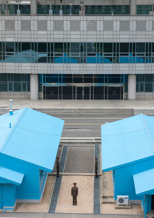 North Korean soldiers standing in front of the United Nations conference rooms on the demarcation line in the Demilitarized Zone, North Hwanghae Province, Panmunjom, North Korea