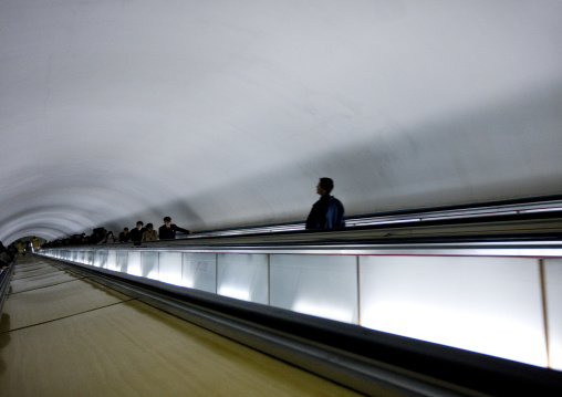 North Korean people using escalator leading to the subway station, Pyongan Province, Pyongyang, North Korea