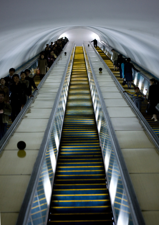 North Korean people using escalator leading to the subway station, Pyongan Province, Pyongyang, North Korea