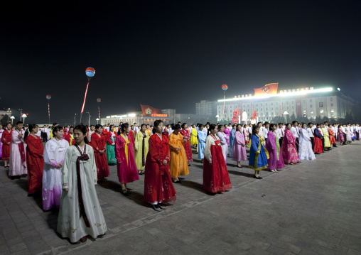 North Korean students dancing to celebrate april 15 the birth anniversary of Kim Il-sung on Kim il Sung square, Pyongan Province, Pyongyang, North Korea