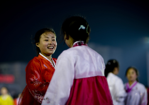 North Korean students dancing to celebrate april 15 the birth anniversary of Kim Il-sung on Kim il Sung square, Pyongan Province, Pyongyang, North Korea