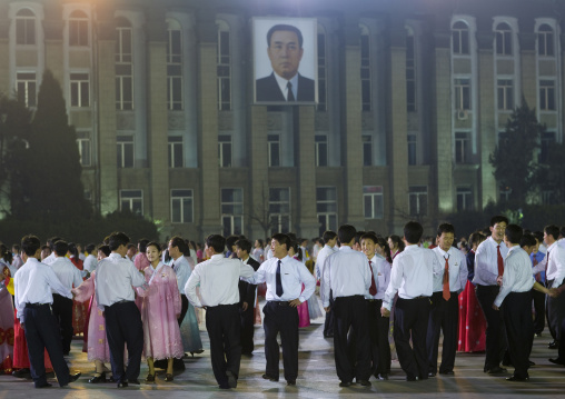 North Korean students dancing to celebrate april 15 the birth anniversary of Kim Il-sung on Kim il Sung square, Pyongan Province, Pyongyang, North Korea