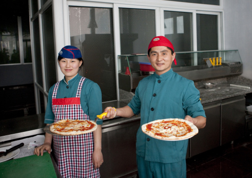 North Korean cooks in a pizzeria, Pyongan Province, Pyongyang, North Korea