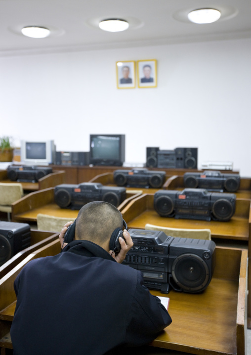 North Korean man listening to music in the multimedia room of the Grand people's study house, Pyongan Province, Pyongyang, North Korea