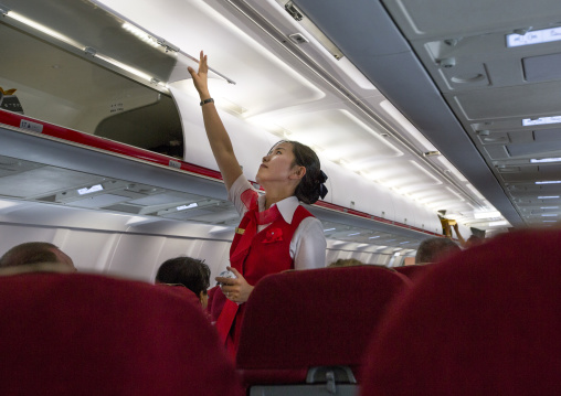 Flight attendant inside an air Koryo tupolev plane, Pyongan Province, Pyongyang, North Korea