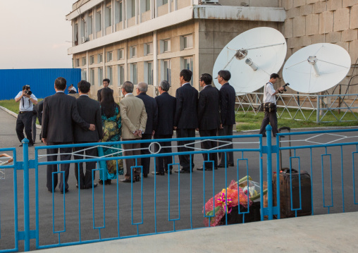 North Korean officials posing for a picture in Pyongyang Sunan international airport, Pyongan Province, Pyongyang, North Korea