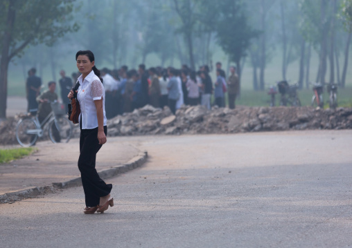 North Korean woman joining a group for collective works, Pyongan Province, Pyongyang, North Korea