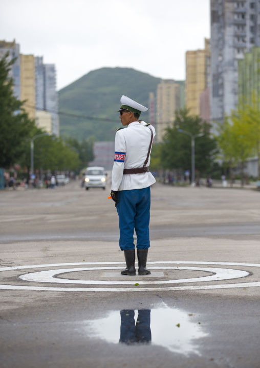 North Korean male traffic security officer in white uniform in the street, North Hwanghae Province, Kaesong, North Korea