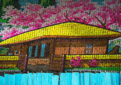 Kim il Sung Mangyongdae native house made by children pixels holding up colored boards during Arirang mass games in may day stadium, Pyongan Province, Pyongyang, North Korea