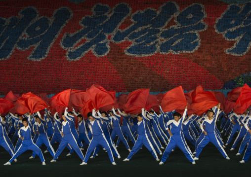 North Korean gymnasts with red flags during the Arirang mass games in may day stadium, Pyongan Province, Pyongyang, North Korea