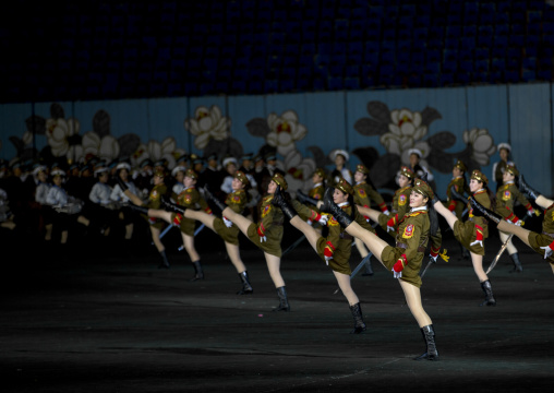 Sexy North Korean women dressed as soldiers dancing with swords during the Arirang mass games in may day stadium, Pyongan Province, Pyongyang, North Korea