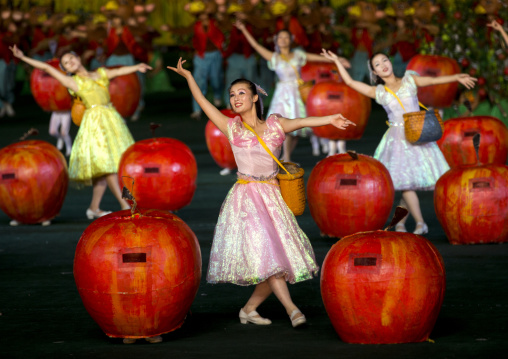 Women dancing between apples at Arirang mass games in may day stadium, Pyongan Province, Pyongyang, North Korea