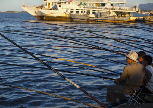 North Korean men fishing in the port, Kangwon Province, Wonsan, North Korea