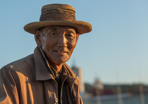 Portrait of a North Korean man with a hat, Kangwon Province, Wonsan, North Korea