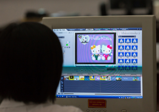 North Korean woman working on a computer for an editing classroom in Mangyongdae children's palace, Pyongan Province, Pyongyang, North Korea