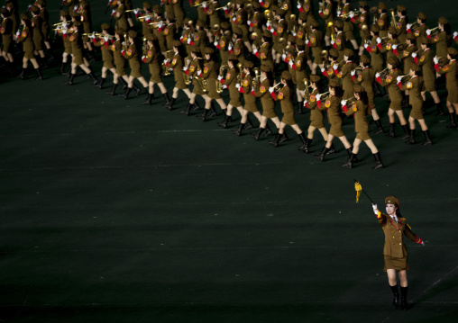 Sexy North Korean women dressed as soldiers dancing with swords during the Arirang mass games in may day stadium, Pyongan Province, Pyongyang, North Korea