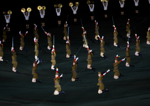 Sexy North Korean women dressed as soldiers dancing with swords during the Arirang mass games in may day stadium, Pyongan Province, Pyongyang, North Korea