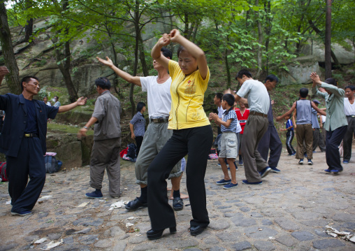 North Korean electricity company workers dancing in a park, North Hwanghae Province, Kaesong, North Korea